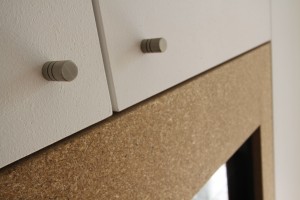 Close up of metal handles on a cupboard.