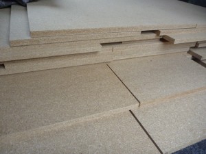 Pieces of cut Strawboard.